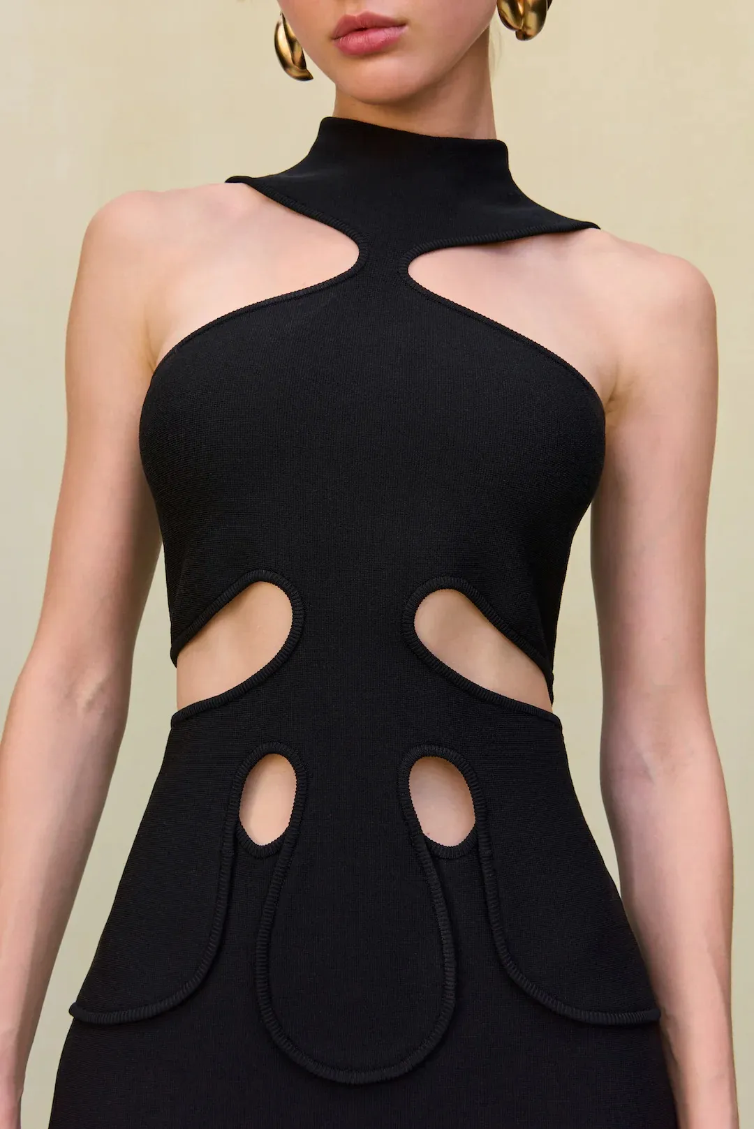 Black Knit Sleeveless Cut-Out Dress with Shoulder & Lower Body Cut-Outs Collared Neckline, Back Zipper, Above Knee Length, Chic for Evening Elegance